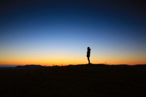 Person Standing with Sunset Background